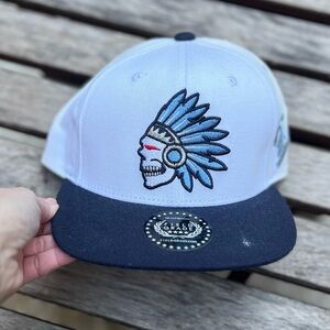 Field Grade brand snapback cap featuring a skull with a headdress logo